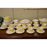 Bristol bone china dinner and tea service having 'cotton grass' pattern against a yellow ground