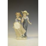 Lladro porcelain figure of a boy and a girl, 25cm high