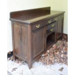 Early 20th Century mahogany-stained sideboard or low dresser with two drawers over bank of two