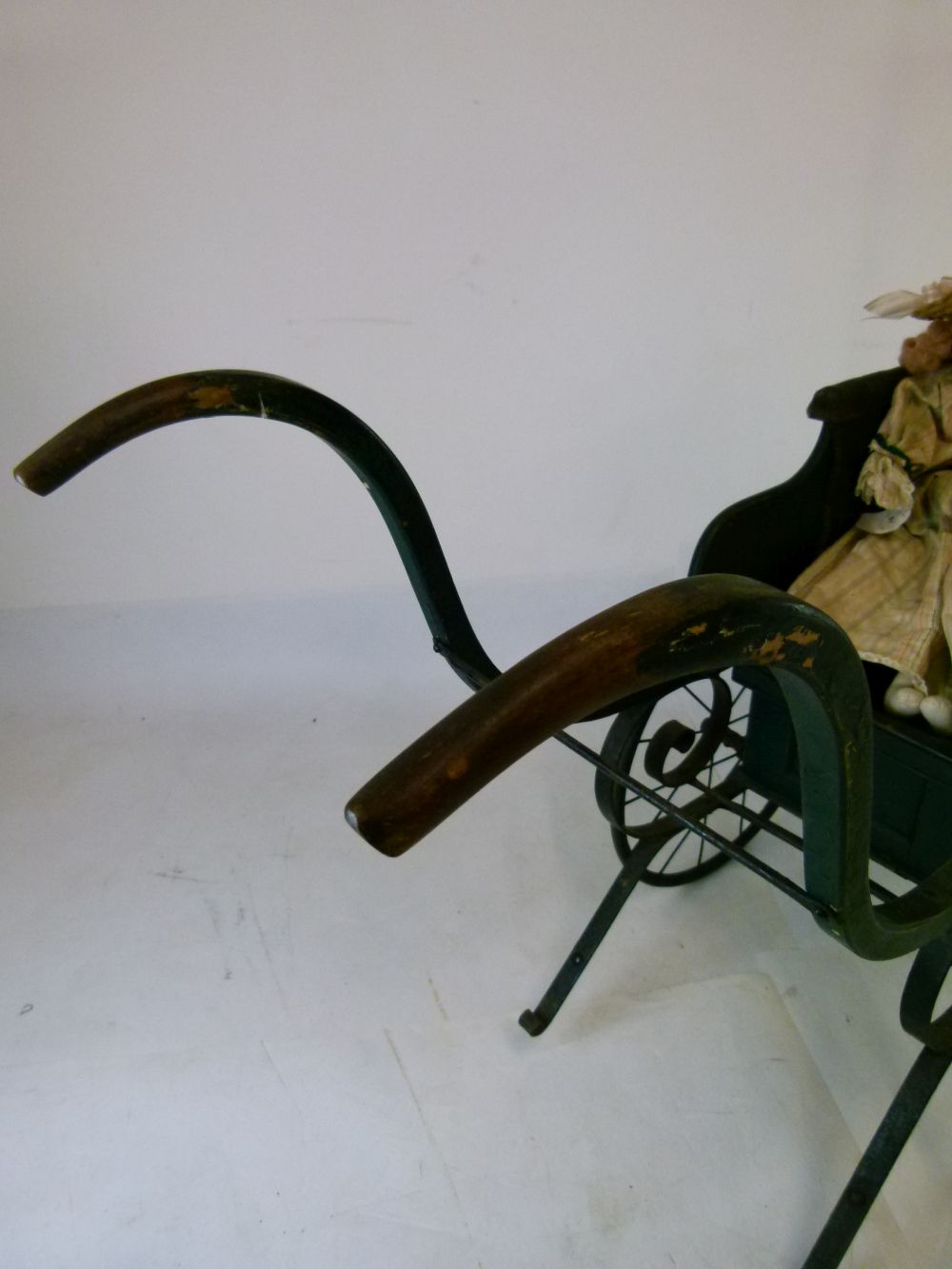 Late Victorian green painted wooden and iron perambulator (pram), with deep-buttoned hide seat- - Image 3 of 8