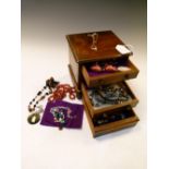 Miniature chest of drawers containing a selection of costume and other jewellery to include; 9ct