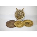 Large quantity of decorative brass ornaments, shields, candlestick etc