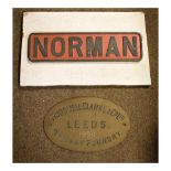 Railway - Cast name plate 'Norman', 43cm wide, and a Hudswell Clark & Co Leeds railway foundry