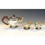 George VI silver three-piece tea set of shaped rectangular form, Birmingham 1939/41, 15cm high, 31.