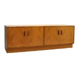 Suite of G-Plan teak furniture comprising: two sideboards and a TV stand