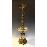 Reproduction brass and ceramic table centre with winged figure, 77cm high