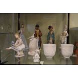 Quantity of Lladro and Nao figures and a Lladro Society scroll ornament