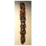 Carved and gilt swag decorated with fruit, pine cones etc, 120cm high