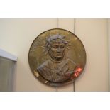 Embossed brass circular plaque depicting Petraque, 29cm diameter