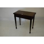 Mid 20th Century stained beech rectangular fold over top card table, 78cm wide