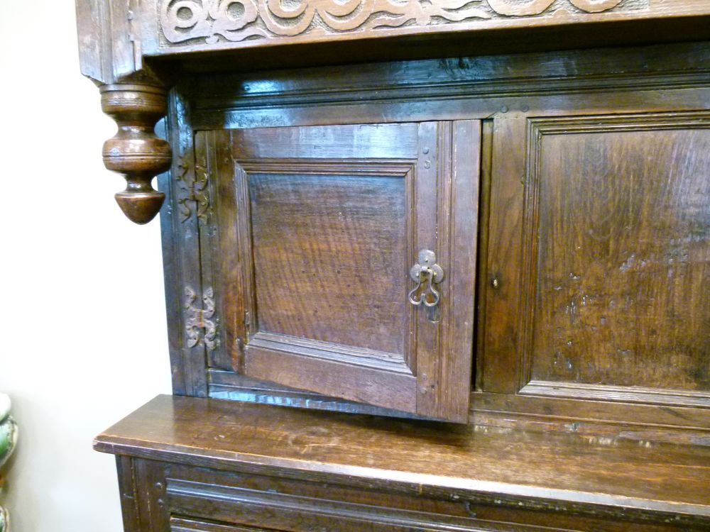 Antique oak heavily carved court cupboard fitted two geometric carved panel doors, the base with a - Image 4 of 10