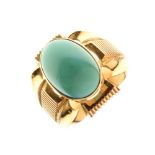 Gold coloured metal turquoise set dress ring with two indistinct stamps inside the shank, 14.8g