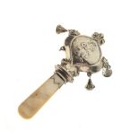 George VI Scottish silver child's rattle with embossed decoration of a shepherdess and mother-of-