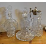 Royal Doulton cut glass ships decanter, four other decanters and a silver plated mounted carafe