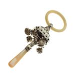 George V silver child's rattle and teething ring having four suspended bells and mother-of-pearl