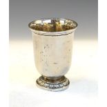 White metal goblet standing on a stepped pedestal with embossed leaf decoration, 9cm high, 2.3toz