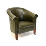 Tub chair upholstered in green leather effect covering