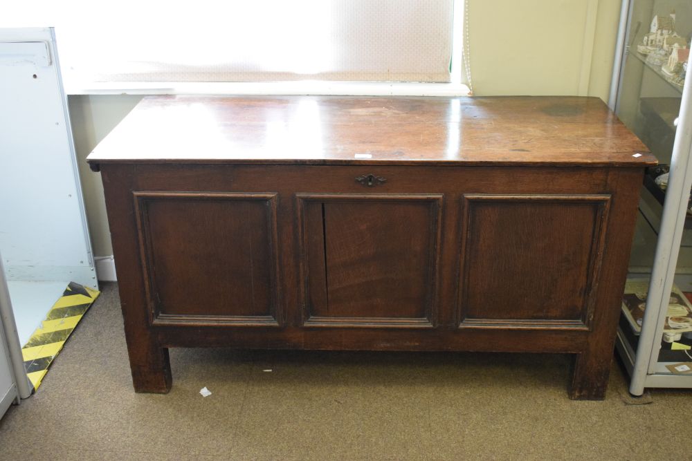 18th Century oak coffer having triple fielded panel front and hinged cover, 135cm wide