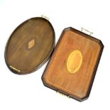 Two early 20th Century mahogany and string inlaid two handled tea trays, both having inlaid shell