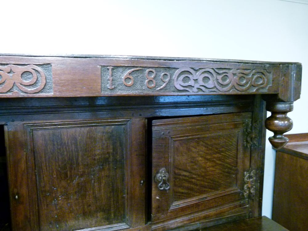 Antique oak heavily carved court cupboard fitted two geometric carved panel doors, the base with a - Image 2 of 10