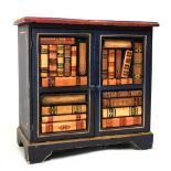 Carved painted side cabinet fitted two carved front doors giving the appearance of books in a
