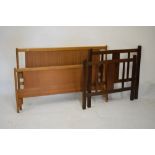 Lebus link oak head and footboard, 4'6" wide, together with an oak single bedstead