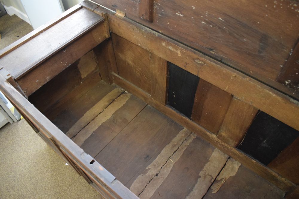 18th Century oak coffer having triple fielded panel front and hinged cover, 135cm wide - Image 4 of 5