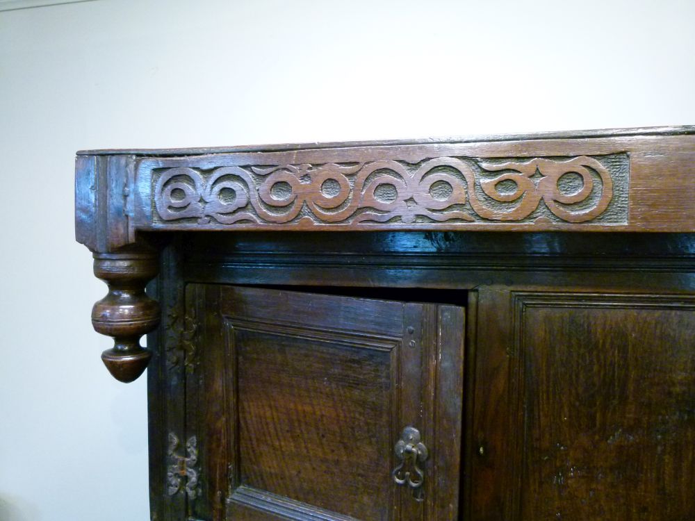 Antique oak heavily carved court cupboard fitted two geometric carved panel doors, the base with a - Image 3 of 10