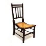Late 19th/early 20th Century stained beech ball turned, cane seat nursing chair