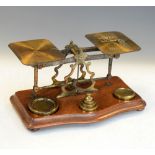 Brass postage scales, together with a selection of weights
