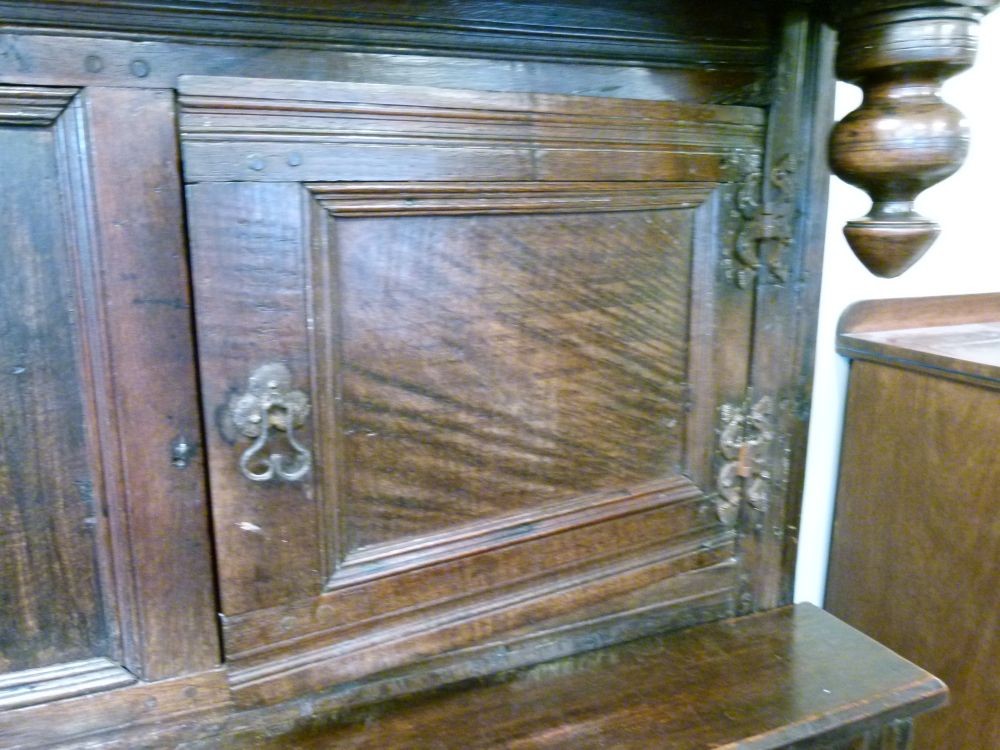 Antique oak heavily carved court cupboard fitted two geometric carved panel doors, the base with a - Image 5 of 10