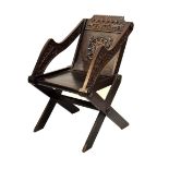 Heavily carved oak Glastonbury elbow chair