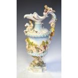 Continental porcelain ewer decorated with cherubs, 38cm high