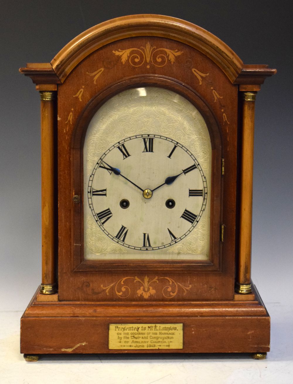 Early 20th Century mahogany and marquetry cased arch dial table clock, presentation inscription