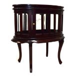Reproduction mahogany oval cocktail cabinet having tray top, raised on cabriole supports, 72cm wide