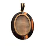 Agate oval locket approximately 4cm x 3cm on an unmarked yellow metal enamelled loop, 18g gross