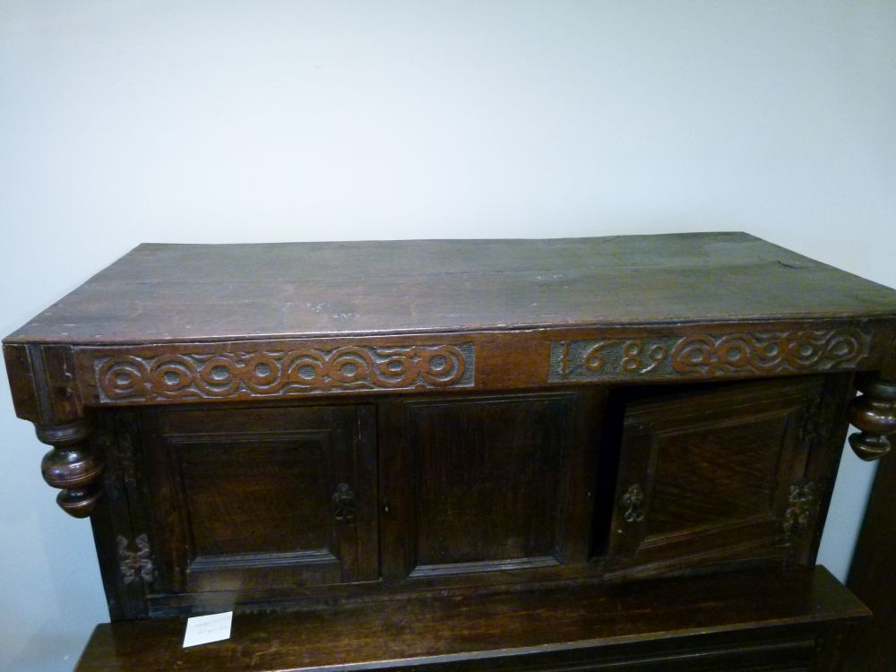 Antique oak heavily carved court cupboard fitted two geometric carved panel doors, the base with a - Image 10 of 10