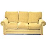 Three seater settee and matching armchair having 'gold diamond' upholstery