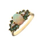 Opal, diamond and emerald set dress ring, the shank stamped 14k, size M, 3.1g gross approx