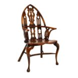 Reproduction elm seat Gothic back Windsor type elbow chair, raised on cabriole front supports