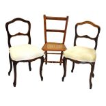 Pair of rosewood buckle back chairs and one other beech cane seat chair