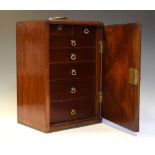 19th Century mahogany collectors cabinet, the hinged door revealing seven graduated shelves with