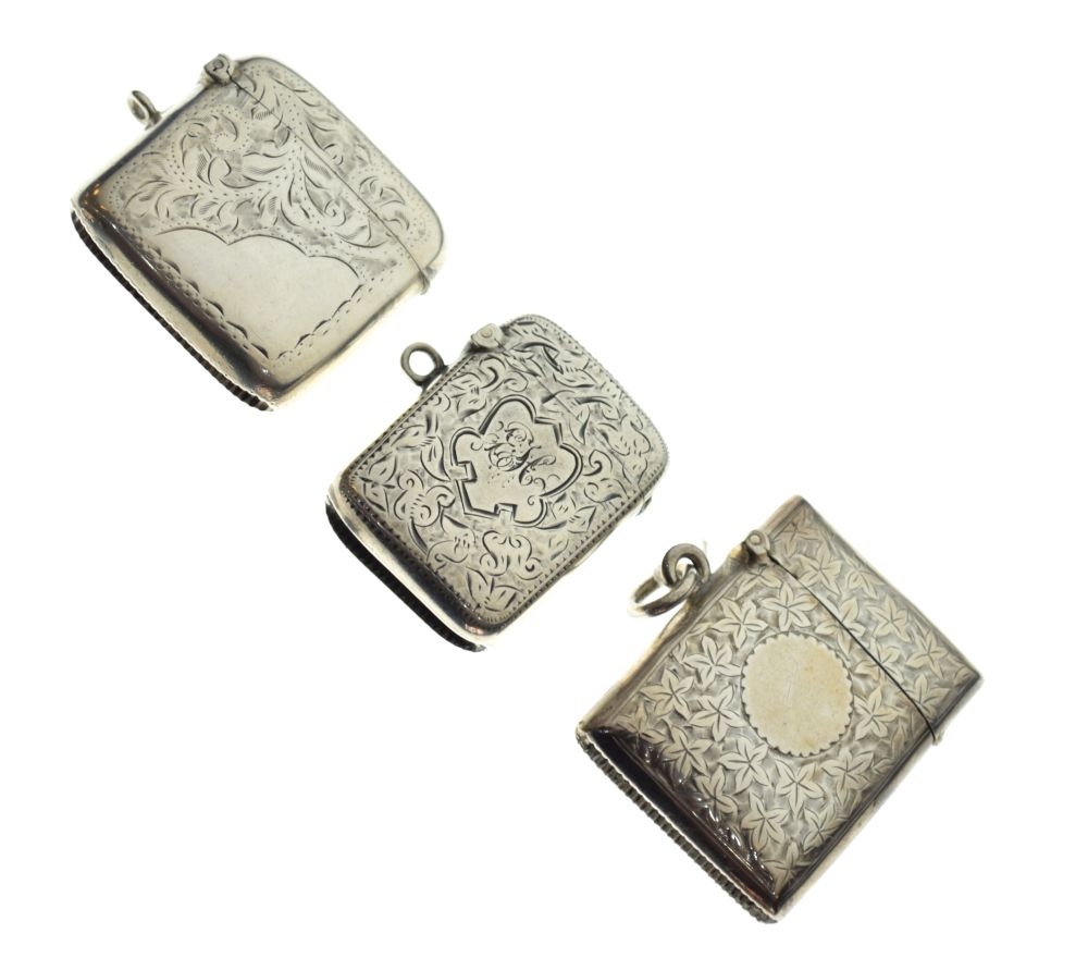 Three early 20th Century silver vesta cases with engraved floral decoration, Birmingham 1900, 1902