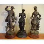 Pair of French spelter figures of a lady and gentleman on simulated marble bases, and one other
