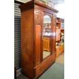 Victorian walnut wardrobe having central mirror panel door with fitted interior and drawer below,