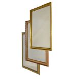 Three large rectangular framed mirrors
