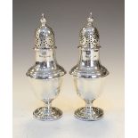 Pair of late Victorian silver pepperettes, Sheffield 1888, 12.5cm high