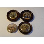 Four 19th Century Prattware pot lids, three in wooden mounts, largest 9cm diameter