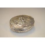 Continental silver oval box having repoussé figural decoration of a girl and boy with their dog,