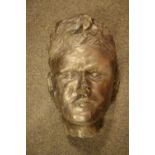 Composite stone mask having gold painted surface, 34cm high